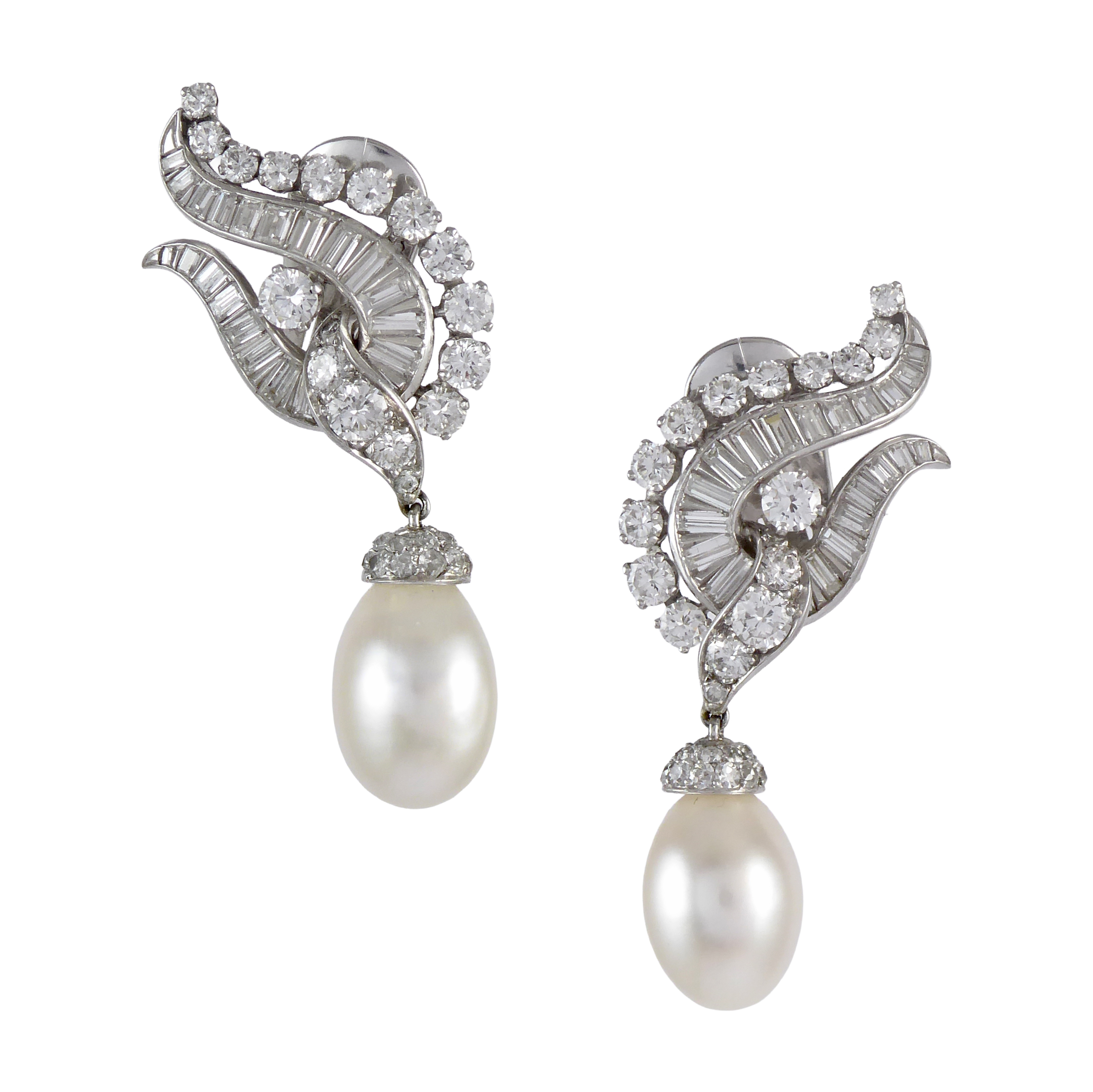 Pair of diamond cluster and natural pearl drop pendant earrings by Van Cleef & Arpels, New York, each hung with a white drop pearl 8.48ct & 7.66ct,